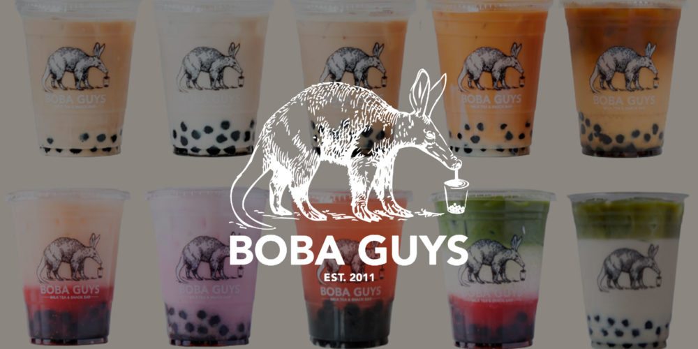 Boba Guys logo on top of an image of colorful cups of boba tea.